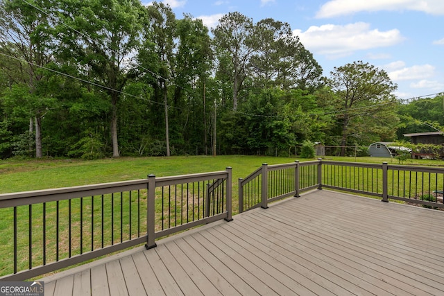 wooden terrace with a yard
