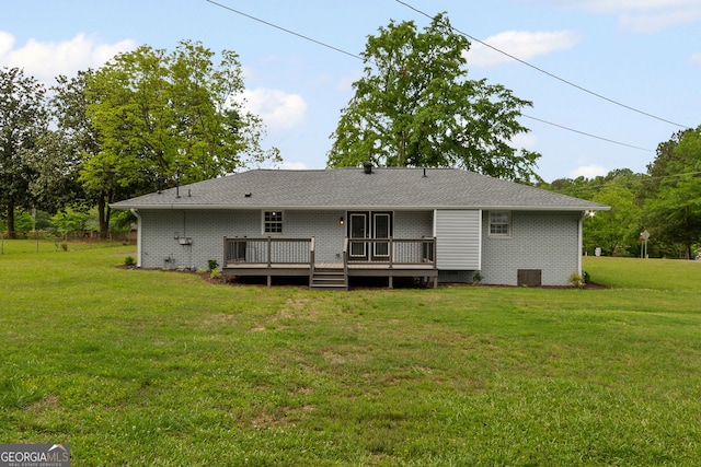 rear view of property with central air condition unit, a deck, and a lawn