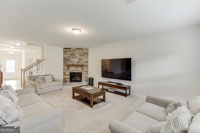 6438 Hickory Branch Dr, Hoschton, GA 30548 - living room with light colored carpet, a fireplace, and stairs