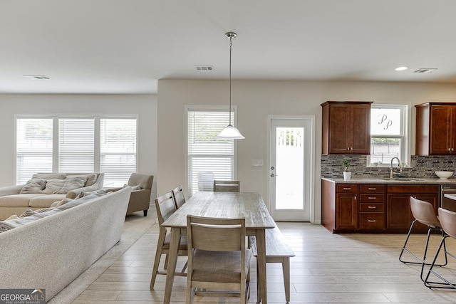 6438 Hickory Branch Dr, Hoschton, GA 30548 - dining room with light wood-style flooring and recessed lighting