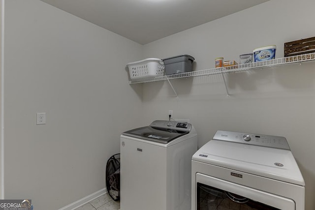 6438 Hickory Branch Dr, Hoschton, GA 30548 - washroom featuring washer and dryer and light tile patterned floors