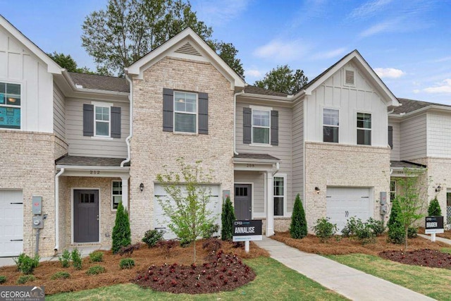 348 Navigator Ln, Mcdonough, GA 30253 - multi unit property featuring board and batten siding, an attached garage, and brick siding