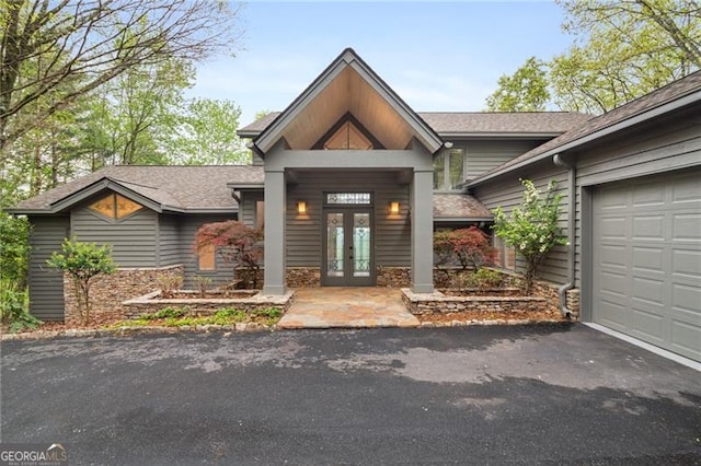 111 Wood Fern Knl, Jasper, GA 30143 - view of front of home featuring an attached garage, stone siding, french doors, aphalt driveway, and a shingled roof