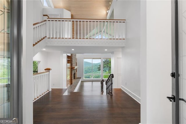 111 Wood Fern Knl, Jasper, GA 30143 - entrance foyer featuring a towering ceiling, wood finished floors, and baseboards