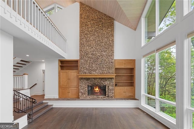 111 Wood Fern Knl, Jasper, GA 30143 - unfurnished living room with stairs, a fireplace, high vaulted ceiling, and wood finished floors