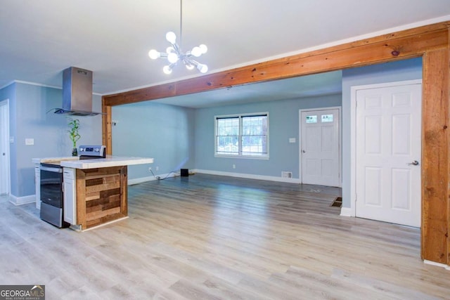 3627 Groovers Lake Rd, Lithia Springs, GA 30122 - kitchen with island exhaust hood, baseboards, light wood-type flooring, and a chandelier