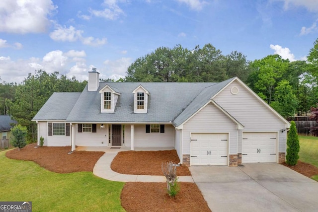 220 Makers Way, Dawsonville, GA 30534 - cape cod home featuring covered porch, an attached garage, a chimney, concrete driveway, and a front lawn