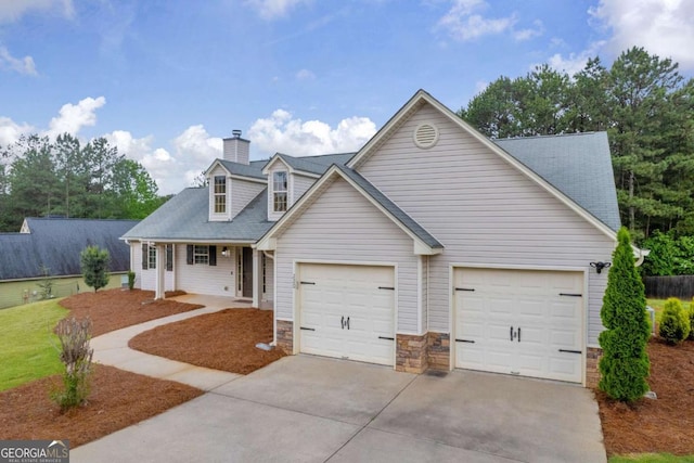 220 Makers Way, Dawsonville, GA 30534 - view of front of home featuring covered porch, an attached garage, concrete driveway, a chimney, and a shingled roof