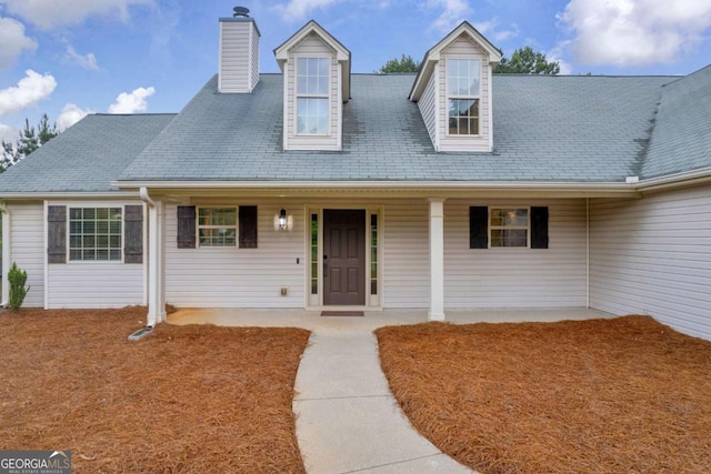 220 Makers Way, Dawsonville, GA 30534 - cape cod-style house with covered porch and a chimney