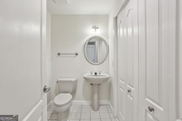 3475 Oak Valley Rd NE Unit 2060, Atlanta, GA 30326 - half bath with toilet, baseboards, and tile patterned floors