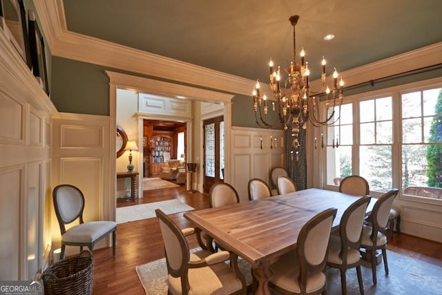 1345 Cashiers Way, Roswell, GA 30075 - dining space with ornamental molding, a chandelier, dark wood-type flooring, and a decorative wall