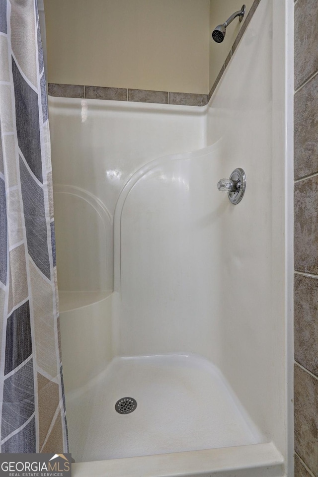 full bathroom featuring walk in shower