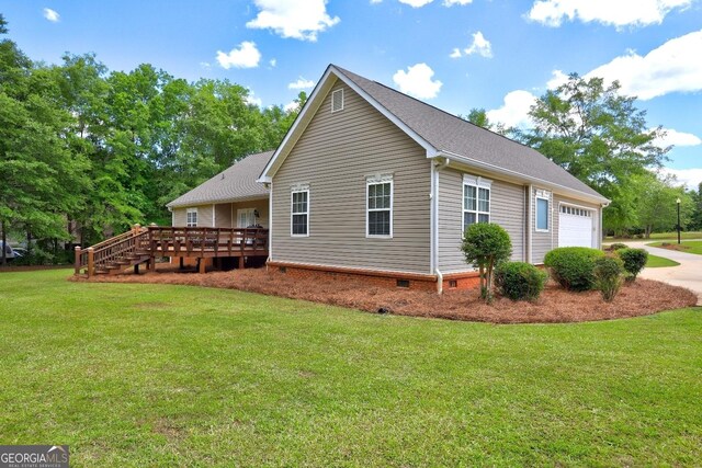 view of home's exterior featuring a deck, crawl space, concrete driveway, a garage, and a lawn