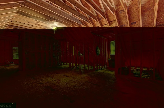 miscellaneous room with lofted ceiling