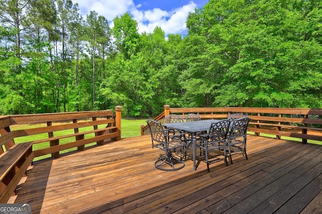 deck with outdoor dining space