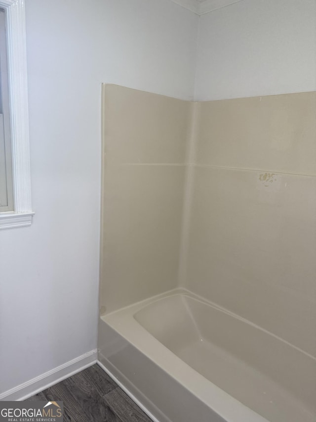 full bathroom with baseboards