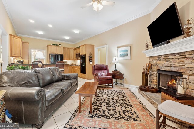 6125 Fouts Mill Rd, Douglasville, GA 30135 - living room featuring crown molding, ceiling fan, light tile patterned floors, baseboards, and a stone fireplace