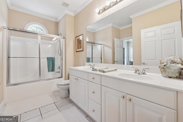 6125 Fouts Mill Rd, Douglasville, GA 30135 - bathroom featuring a sink, visible vents, crown molding, enclosed tub / shower combo, and double vanity