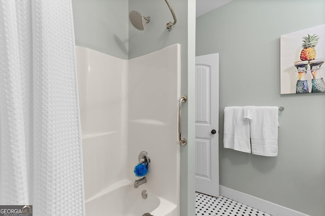 1261 Otter Slide Loop NE, Townsend, GA 31331 - bathroom with shower / bathtub combination with curtain and baseboards