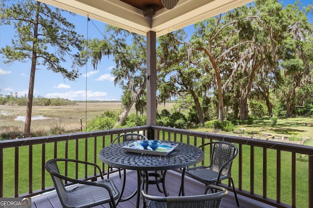 1261 Otter Slide Loop NE, Townsend, GA 31331 - wooden terrace featuring a yard
