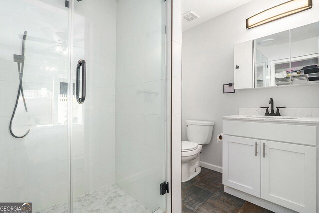 2716 Suwanee Way SE, Marietta, GA 30067 - full bathroom with vanity, toilet, visible vents, and a shower stall
