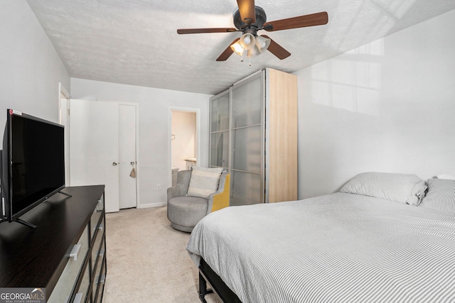 2716 Suwanee Way SE, Marietta, GA 30067 - bedroom featuring light colored carpet, a textured ceiling, baseboards, and ceiling fan