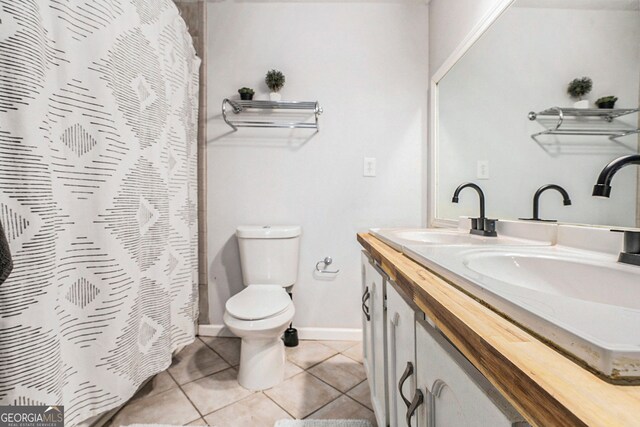 2716 Suwanee Way SE, Marietta, GA 30067 - bathroom with double vanity, toilet, tile patterned flooring, and a sink