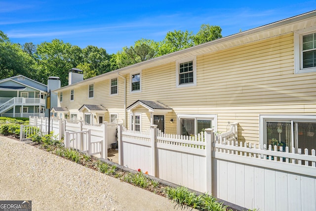 2716 Suwanee Way SE, Marietta, GA 30067 - view of property with fence and a chimney