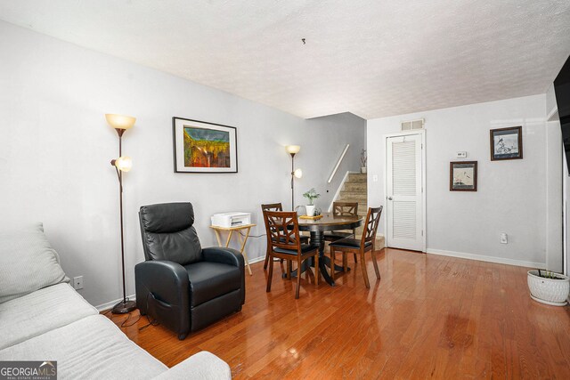 2716 Suwanee Way SE, Marietta, GA 30067 - living room with stairway, baseboards, light wood-type flooring, and visible vents