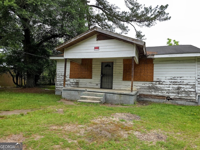 3724 Hitchcock Rd, Macon, GA 31217 - view of front of home featuring a porch and a front yard