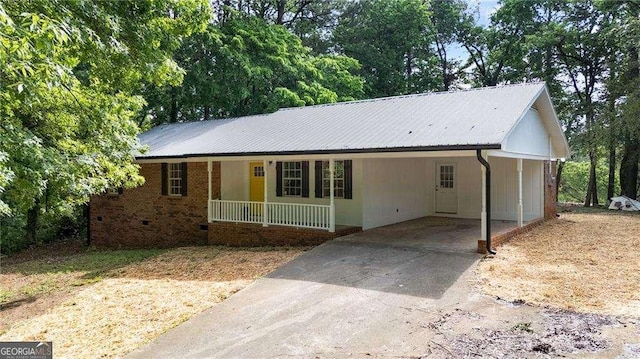 196 Highland Dr, Calhoun, GA 30701 - ranch-style house with driveway, covered porch, metal roof, and a carport