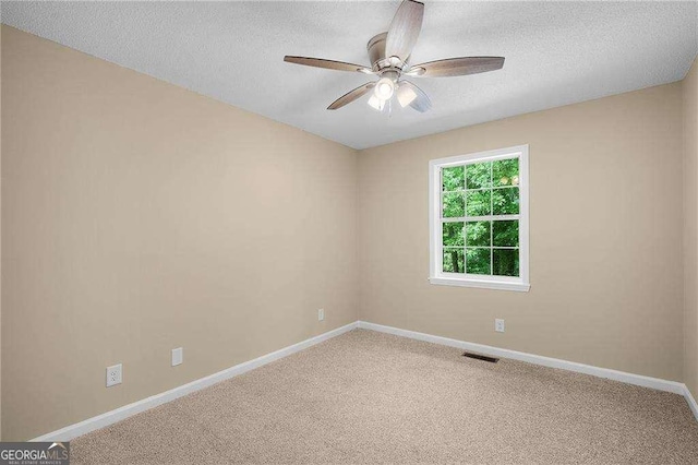 196 Highland Dr, Calhoun, GA 30701 - carpeted empty room with a textured ceiling, visible vents, baseboards, and ceiling fan