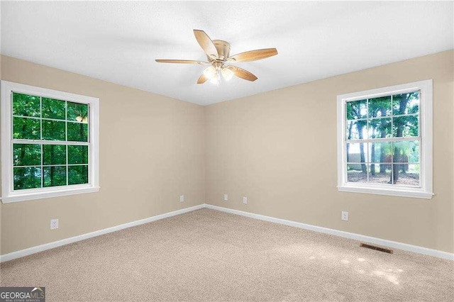 196 Highland Dr, Calhoun, GA 30701 - empty room featuring carpet flooring, visible vents, baseboards, and ceiling fan