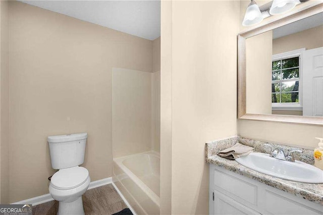 196 Highland Dr, Calhoun, GA 30701 - bathroom with toilet, baseboards, vanity, and shower / washtub combination