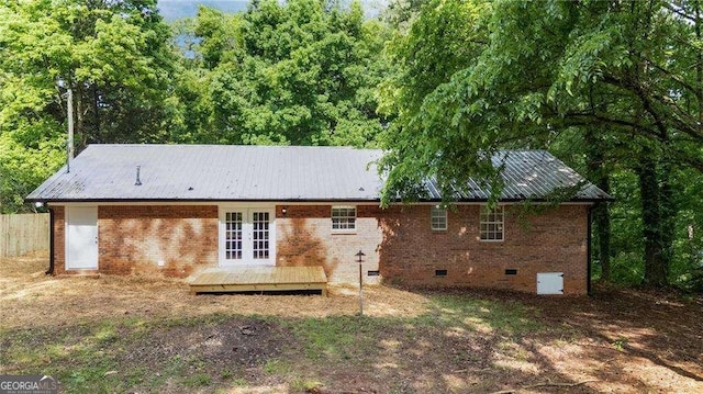 196 Highland Dr, Calhoun, GA 30701 - rear view of property featuring metal roof, brick siding, french doors, and crawl space
