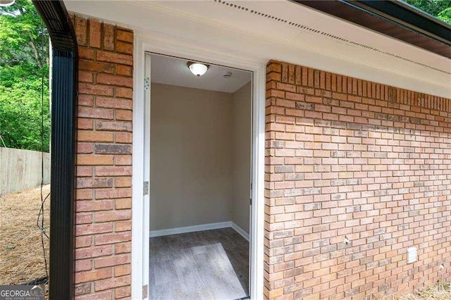 196 Highland Dr, Calhoun, GA 30701 - property entrance with brick siding and fence