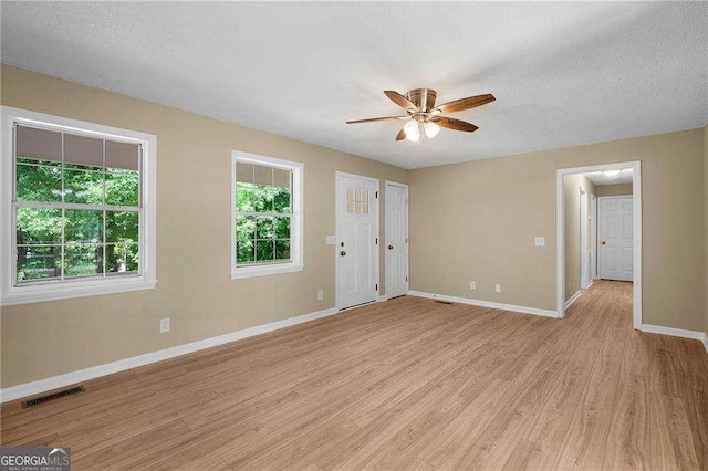 196 Highland Dr, Calhoun, GA 30701 - interior space with light wood-type flooring, visible vents, baseboards, and ceiling fan