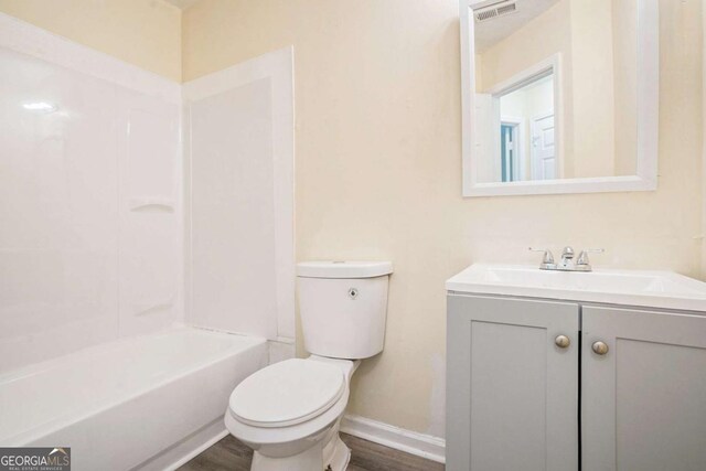 2722 S Hills, Riverdale, GA 30296 - bathroom with toilet, wood finished floors, vanity, visible vents, and baseboards