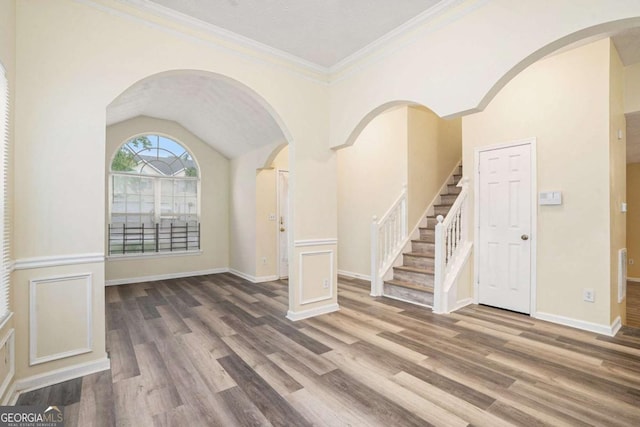 2722 S Hills, Riverdale, GA 30296 - entrance foyer with wood finished floors, crown molding, stairway, baseboards, and arched walkways