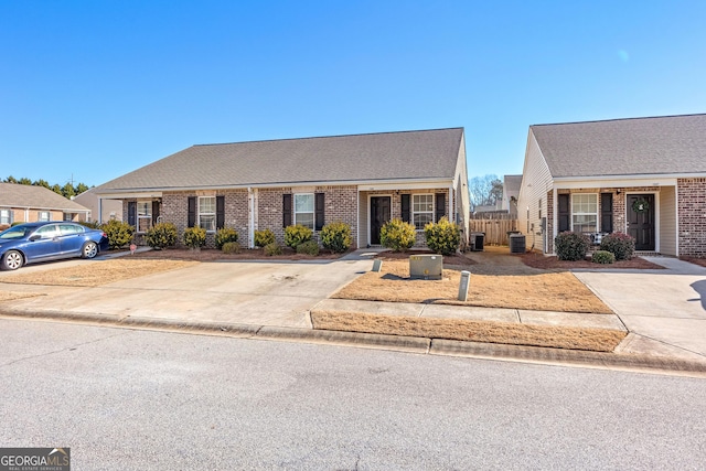 1509 Buffington Way, Griffin, GA 30224 - ranch-style home with central AC unit, brick siding, and fence
