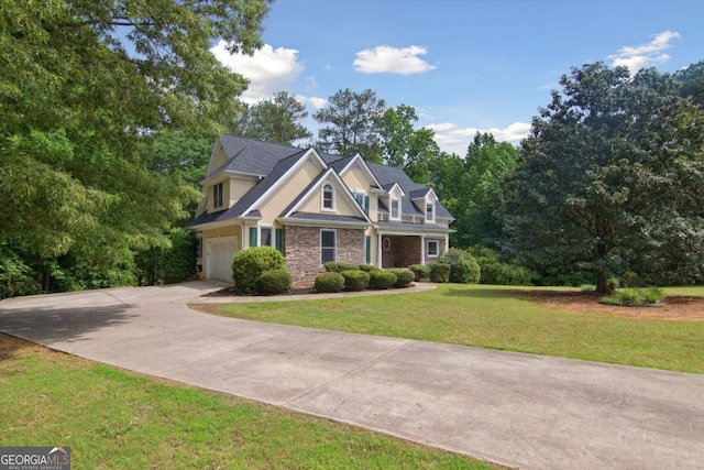 craftsman house with a garage, a front lawn, stone siding, and driveway