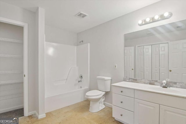 full bath featuring toilet, a closet, bathing tub / shower combination, visible vents, and vanity