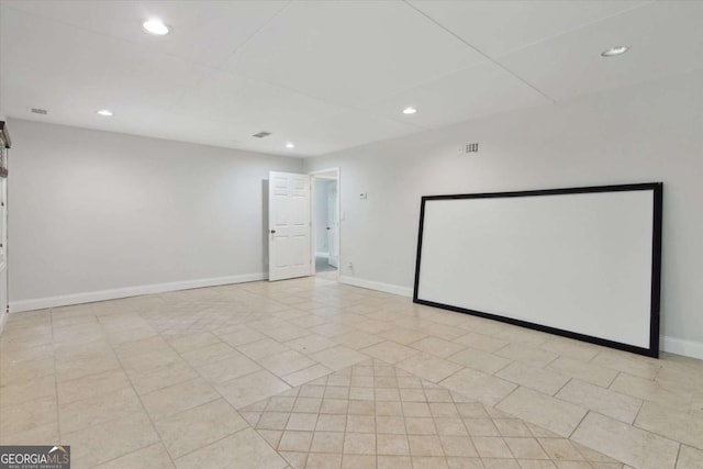 unfurnished room featuring baseboards, visible vents, and recessed lighting