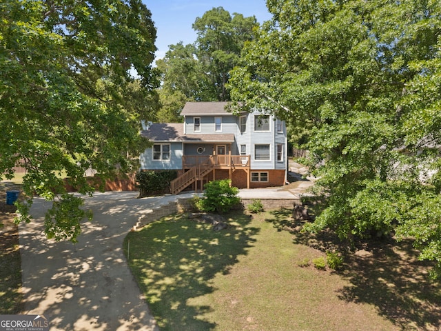 view of front of property with stairs and a deck
