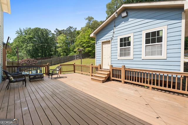 wooden deck with outdoor dining area