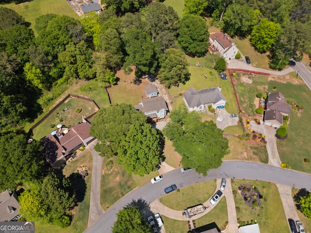 aerial view of property and surrounding area with nearby suburban area