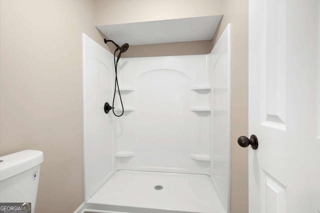 full bath with walk in shower and toilet