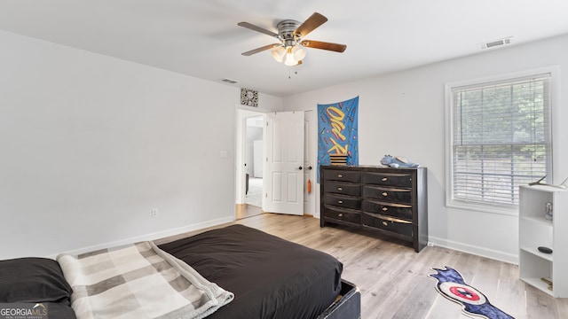 11440 Azalea Trl, Hampton, GA 30228 - bedroom featuring light wood-type flooring, visible vents, baseboards, and a ceiling fan