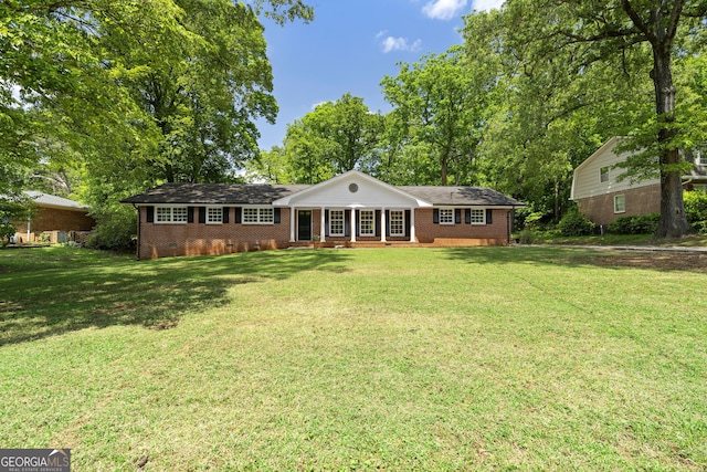 4356 Executive Dr, Stone Mountain, GA 30083 - view of front of house featuring brick siding, crawl space, a front yard, and a porch