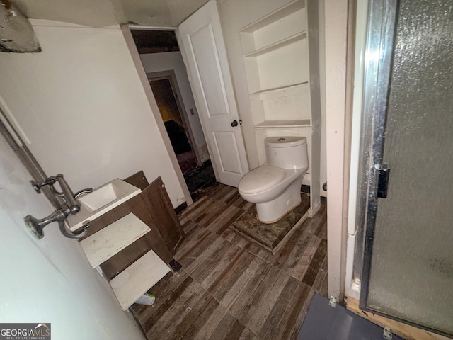 668 Lynn Cir SW, Atlanta, GA 30311 - bathroom with toilet and wood tiled floor